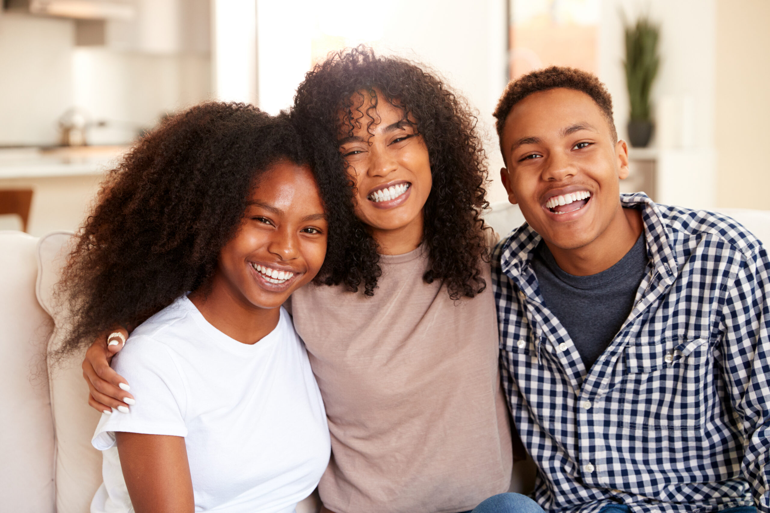 Black,Teen,And,Young,Adult,Brother,And,Sisters,Smiling,To